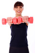 Happy caucasian woman with dumbbells