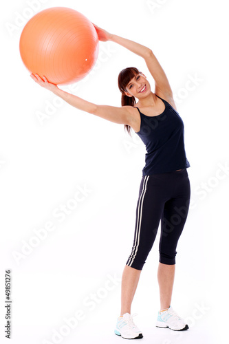 Photo: Happy caucasian woman with fitness ball Happy caucasian woman with fitness ball