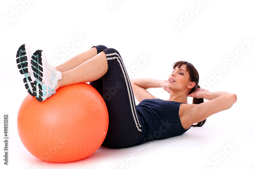 Photo: Happy caucasian woman with fitness ball Happy caucasian woman with fitness ball