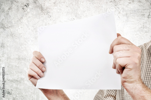 Photo: Hands holding paper Hands holding paper