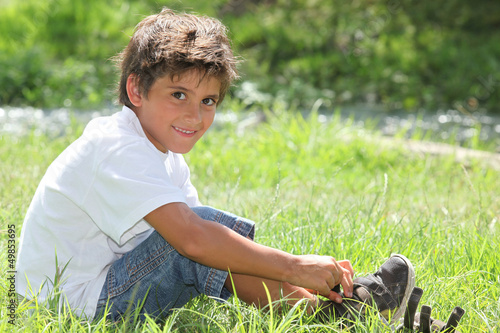 Photo: Child sitting in a field Child sitting in a field