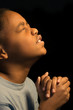 Praying African Americn boy