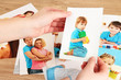 Photos in hands on wooden table