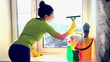 Women cleaning a window