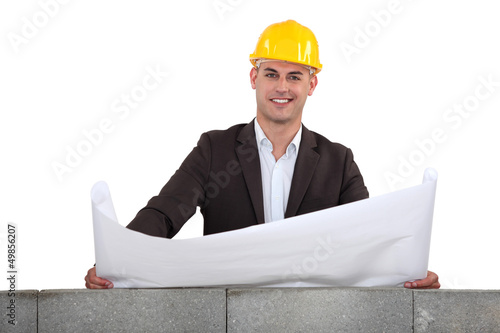 Photo: Checking the blueprints. Checking the blueprints.