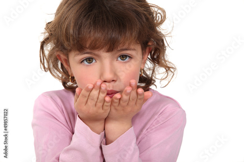 Photo: Cute girl blowing kisses Cute girl blowing kisses