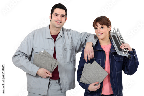 Photo: Couple cutting tiles Couple cutting tiles
