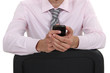 Businessman sat on chair backwards
