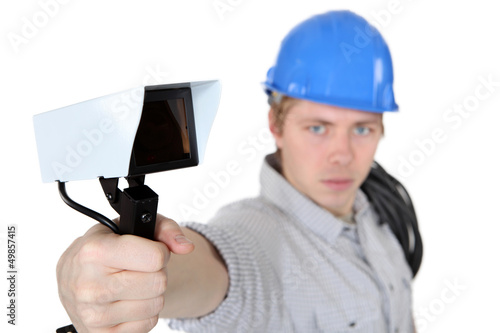Photo: portrait of young electrician against white background portrait of young electrician against white background
