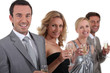 couples standing holding champagne