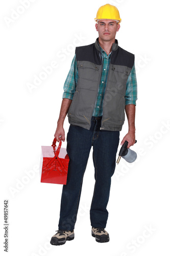 Photo: Worker with toolbox and Jug Worker with toolbox and Jug