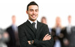 Smiling executive in front of his team