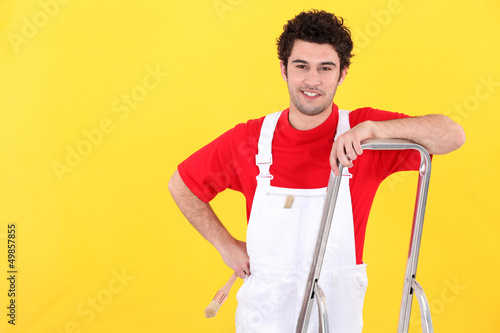 Photo: Painter leaning against ladder Painter leaning against ladder