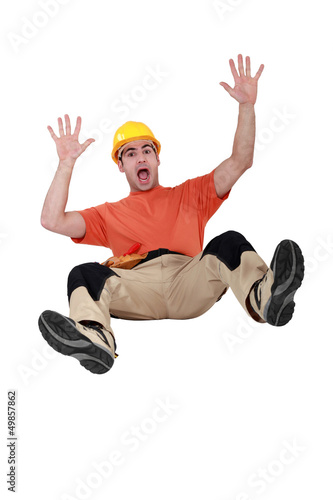 Photo: Tradesman falling backwards Tradesman falling backwards