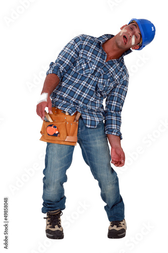 Photo: Tradesman suffering from a work-related injury Tradesman suffering from a work-related injury
