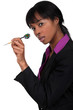 Businesswoman holding dart
