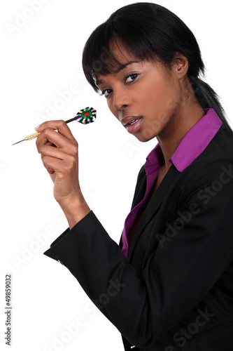 Photo: Businesswoman holding dart Businesswoman holding dart