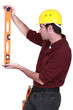 Handyman using spirit-level