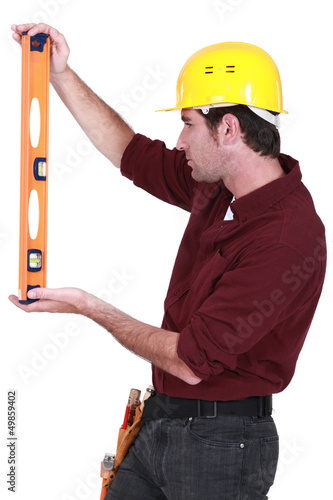 Photo: Handyman using spirit-level Handyman using spirit-level