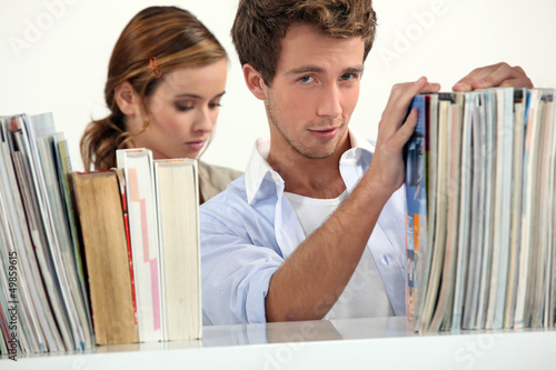 Photo: Couple in a library Couple in a library