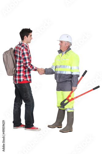 Photo: craftsman and apprentice shaking hands craftsman and apprentice shaking hands