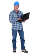 Tradesman holding a laptop