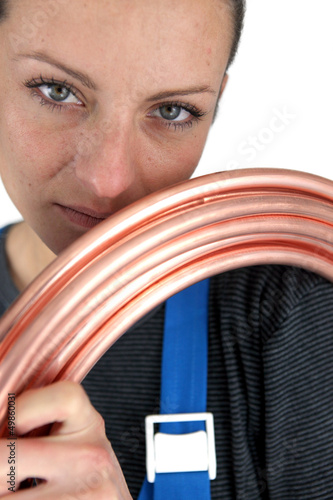 Photo: Portrait of woman with copper pipe Portrait of woman with copper pipe