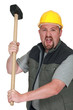 An angry tradesman holding a mallet