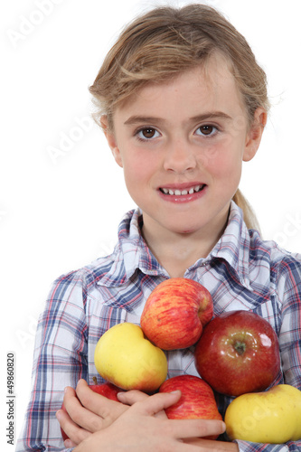 Photo: Little girl holding apples Little girl holding apples