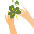 Hands holding clover leaf