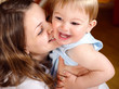 Happy mother playing with son