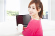 happy asian woman sitting with laptop computer