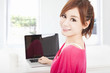 smiling young woman sitting with laptop computer