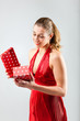 Woman opening the gift and is happy
