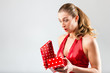 Woman opening the gift and is happy