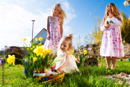 Photo: Children on Easter egg hunt with bunny Children on Easter egg hunt with bunny