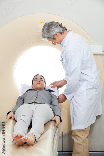 Photo: Doctor Preparing Patient For CT Scan Test Doctor Preparing Patient For CT Scan Test