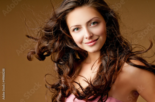 Photo: beautiful woman with perfect curls beautiful woman with perfect curls