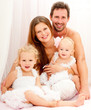 Happy young family. Indoors.