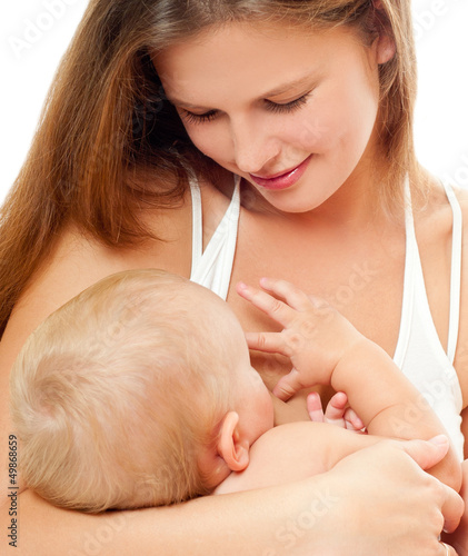 Photo: Mother breast feeding her infant Mother breast feeding her infant