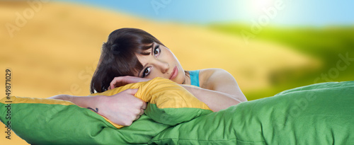 Photo: Portrait of a spring girl napping on pillow. Portrait of a spring girl napping on pillow.