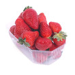 fresh  juicy strawberries in a plastic box isolated on white