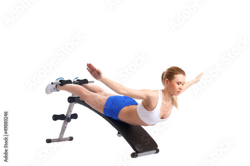Photo: Young blonde woman on exerciser Young blonde woman on exerciser