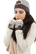 Cute woman wrapped up warm in winter clothes