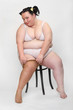 Photo: Overweight woman dressed in underwear in the studio. Overweight woman dressed in underwear in the studio.