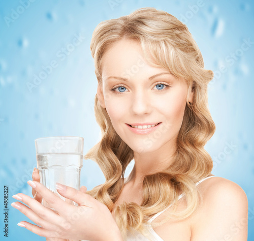 Photo: woman holding glass of water woman holding glass of water