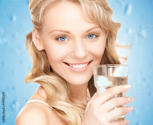 Photo: woman holding glass of water woman holding glass of water