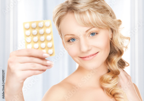 Photo: young woman with pills young woman with pills
