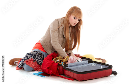Photo: young girl with suitcase on white young girl with suitcase on white