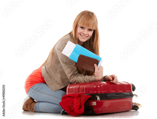 Photo: young girl with suitcase on white young girl with suitcase on white